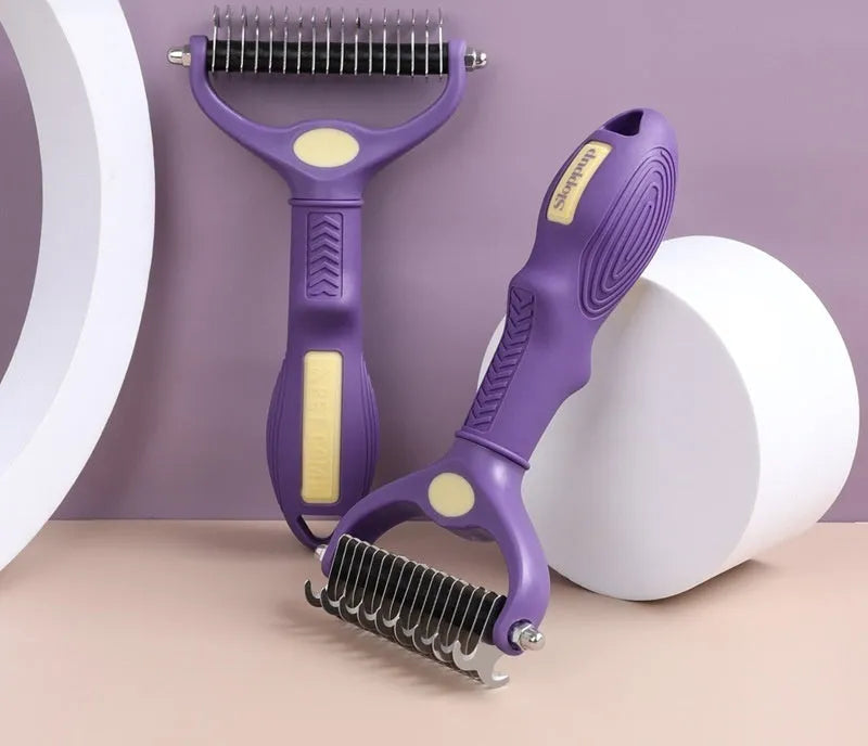 Purple double-sided plastic pet comb for detangling dog and cat fur.