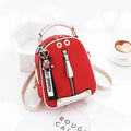 Women's PU leather oval fashion backpack with zip closure, multiple internal pockets and soft handle in white, red, black or pink