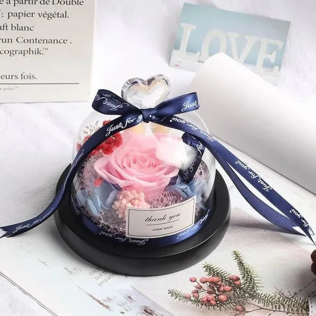 Eternal real rose with LED light inside a 13x13x12cm transparent glass dome, available in multiple colours