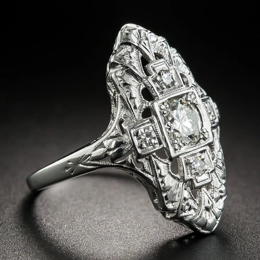 Silver electroplated hollow geometric diamond-studded ring showing negative space band design