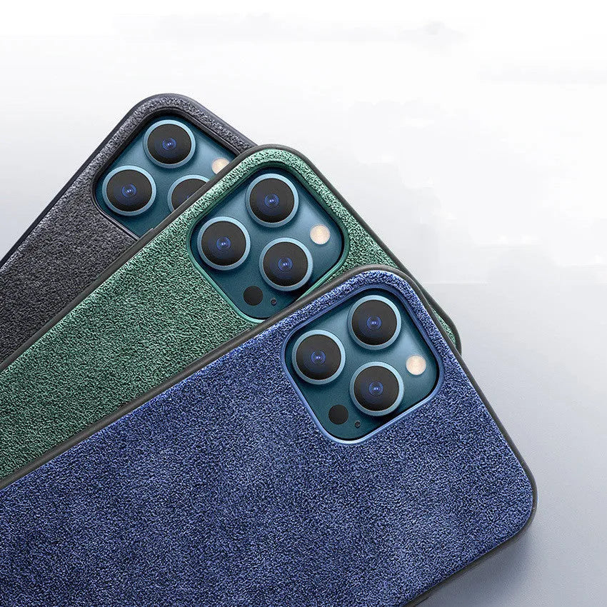A luxury suede iPhone back cover in dark blue, shown fitted on a smartphone.