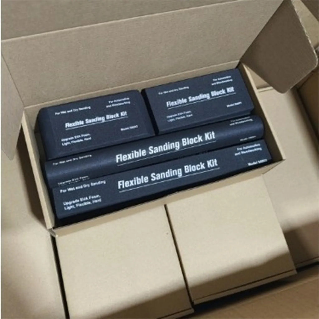 Seven black EVA frosted blocks with metal construction arranged on a work surface