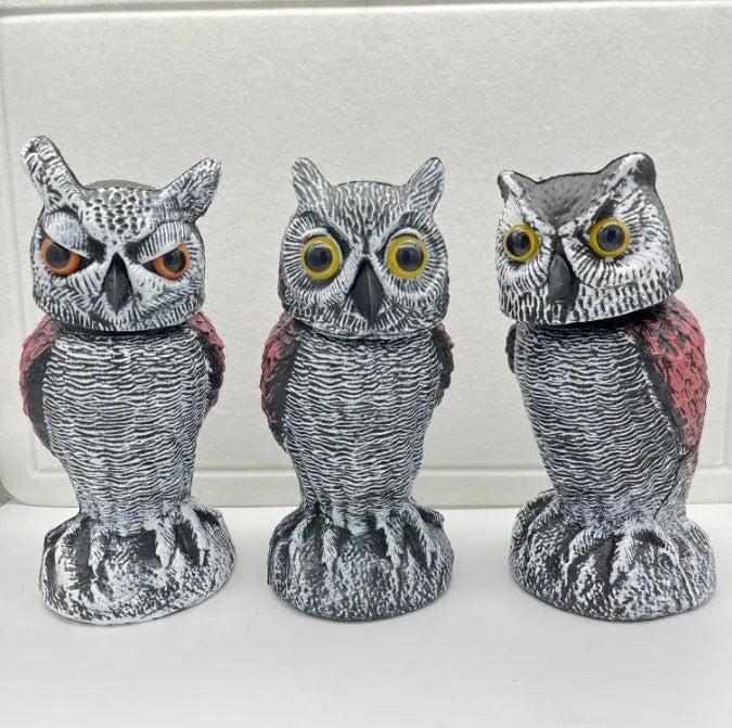 Artificial owl bait ornament with shaking head design for bird deterrent in garden setting