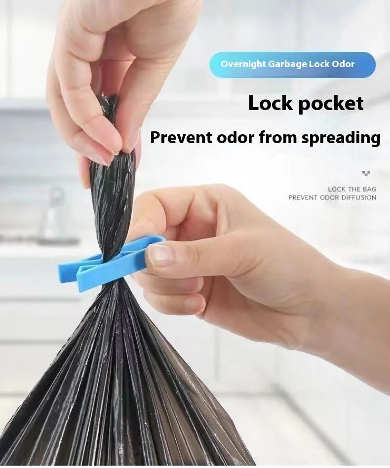 Black plastic non-slip clip for holding bin bags on the side of a trash can.