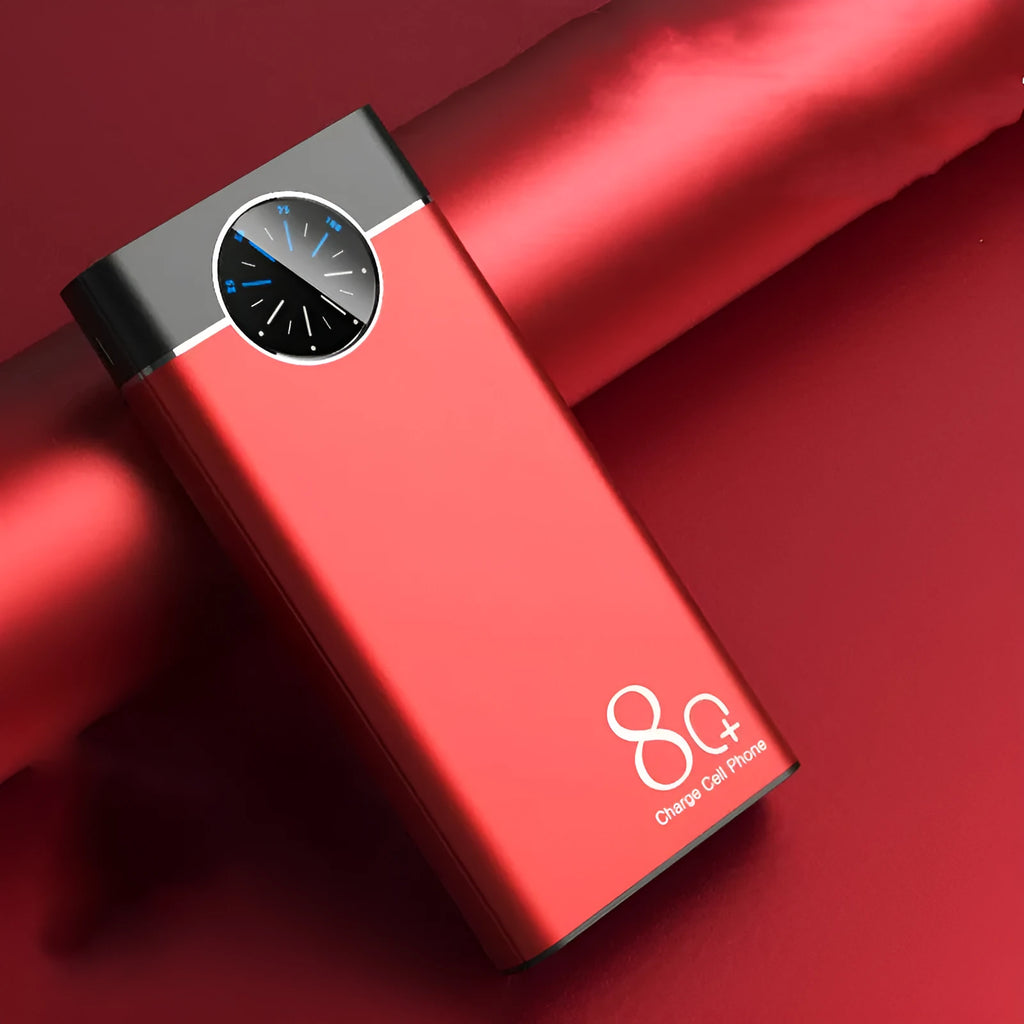 Black fast charging 20000mAh power bank with alloy shell and LED flashlight on a table.