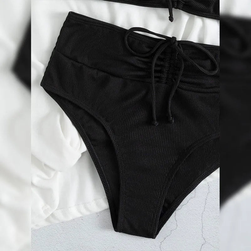 Black women's high waist bikini swimsuit with sling split design showing front view