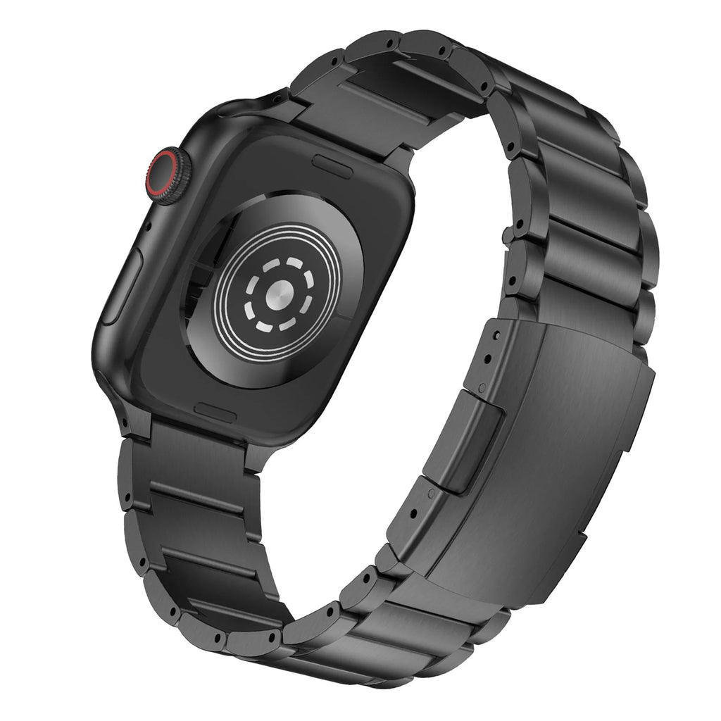 Black titanium alloy Apple Watch replacement strap with folding buckle on a wrist