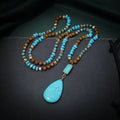 Blue turquoise heart-shaped pendant necklace with water drop silhouette on 81cm ball bead chain