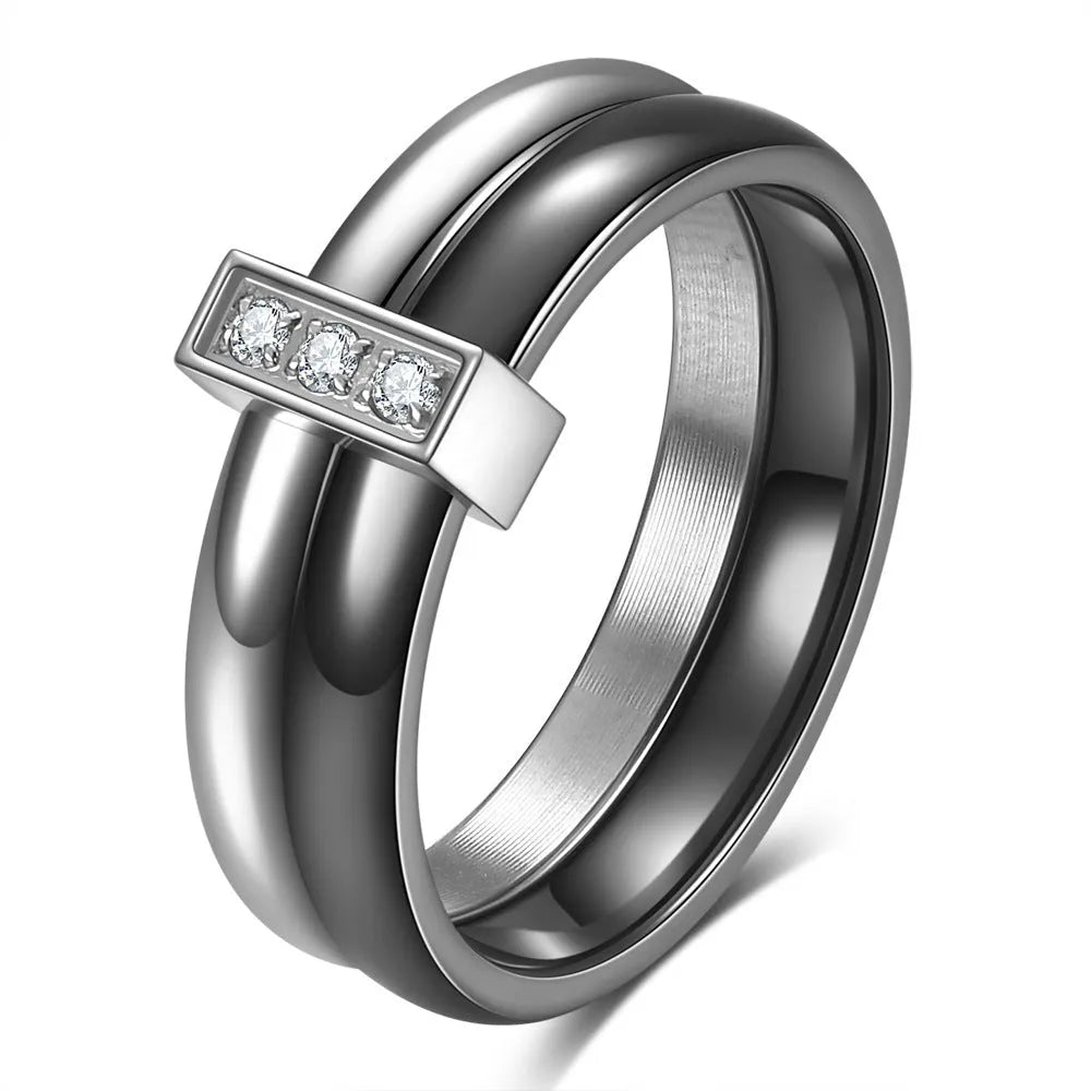Geometric ceramic ring with zirconium inlay, available in steel black or gold white, sizes 6 to 10