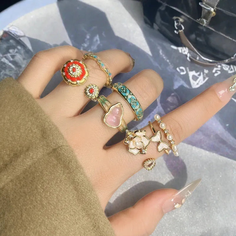Adjustable copper ring with vintage oil-dripping gourd design, inlaid zircon stones, and flower and bow shapes in New Chinese style