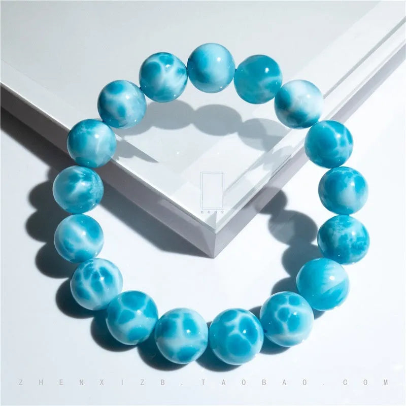 Blue Bodhi bead bracelet with manual processing and pearl accents in Maillard style, showing bead sizing options