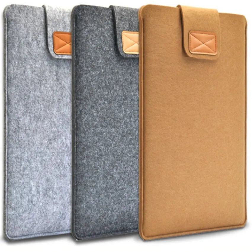 Dark grey clamshell laptop bag showing interior with polyester lining and corner protectors