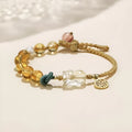 Hand-woven crystal bracelet with animal zodiac design in citrine colour