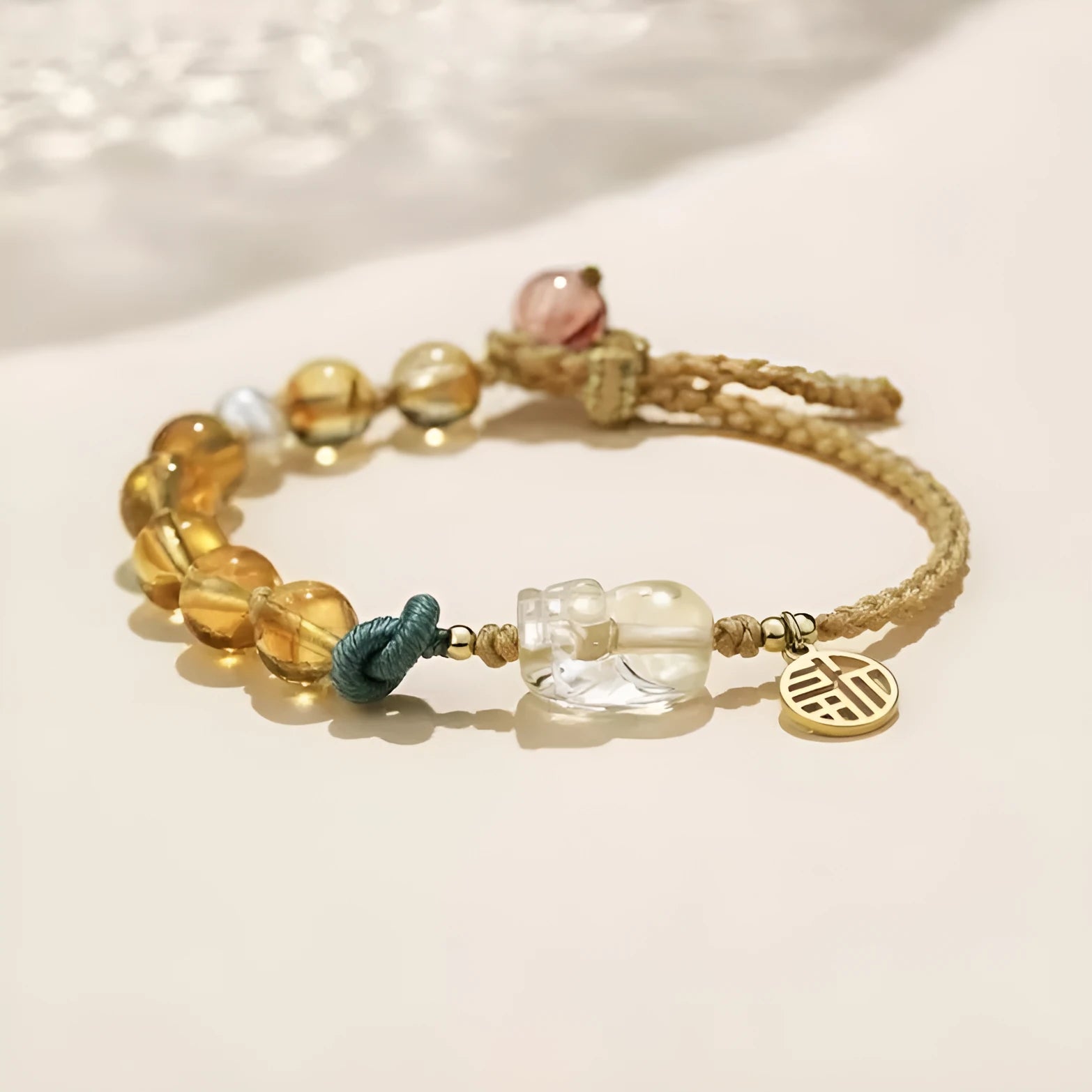 Hand-woven crystal bracelet with animal zodiac design in citrine colour