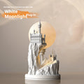White composite gypsum table lamp with a plug-in cord and wire switch, shown on a bedside table.