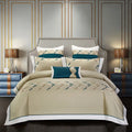 Four-piece cotton embroidery bedding set with 100% fabric, satin weave, and reactive dyeing in UK sizes