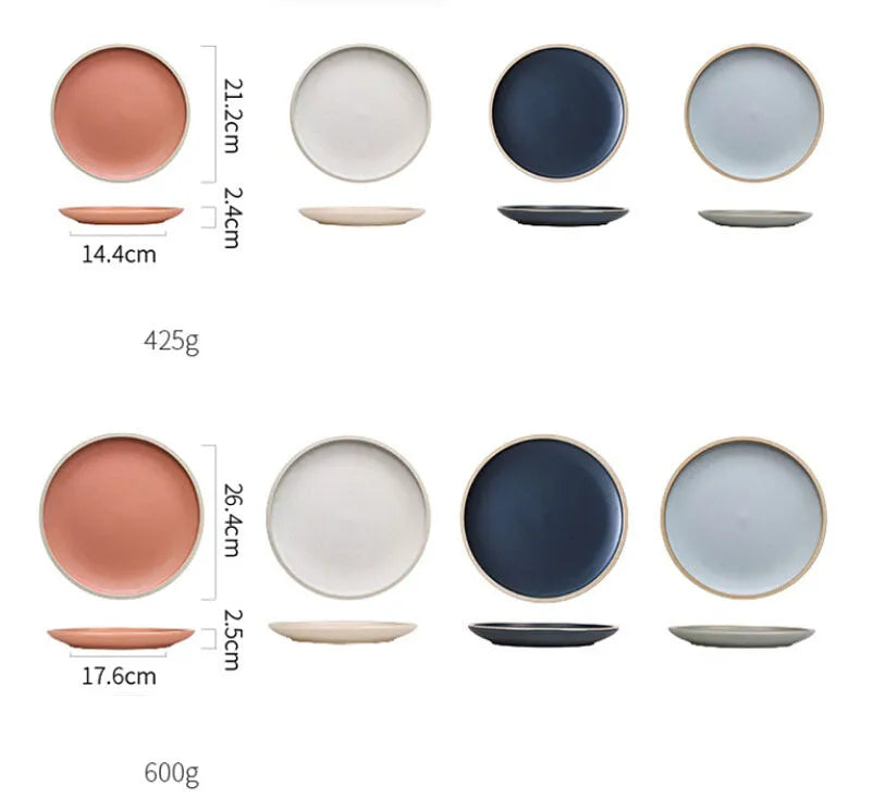 A 10-inch diameter pure blue matte ceramic dinner plate with a subtle textured finish on a wooden table.