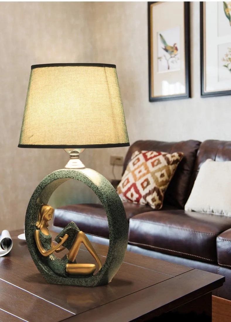 Blue reading girl table lamp in resin and cloth, 20 x 39.8cm, E27 fitting, for bedside or desk use