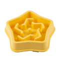 Yellow plastic slow feed dog bowl with textured bottom to prevent choking