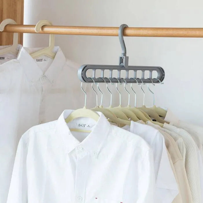 Plastic storage hanger with rotating handle in pink or green, 33 cm long, for heavy clothing