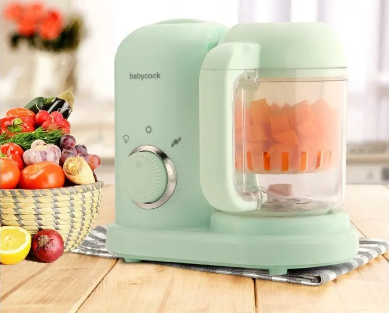 Baby food processor with steamer and blender functions in green or pink, showing 10-litre capacity and double mixing blades