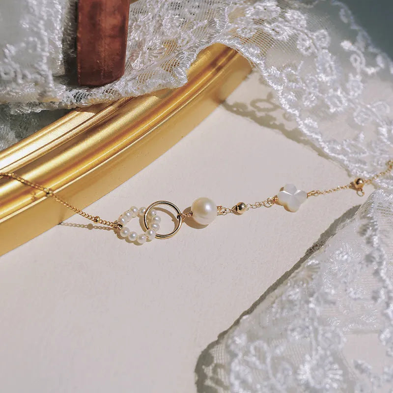 14k gold-plated natural pearl bracelet for women showing pearl and metallic elements