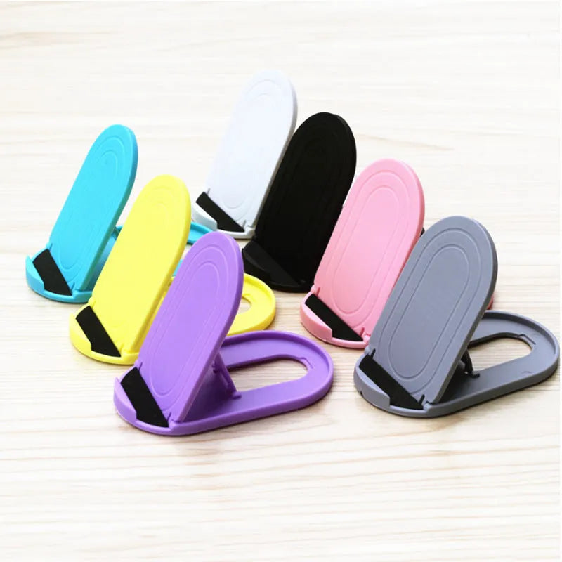 Mobile phone stand with lazy bracket design showing adjustable angles and six colour options