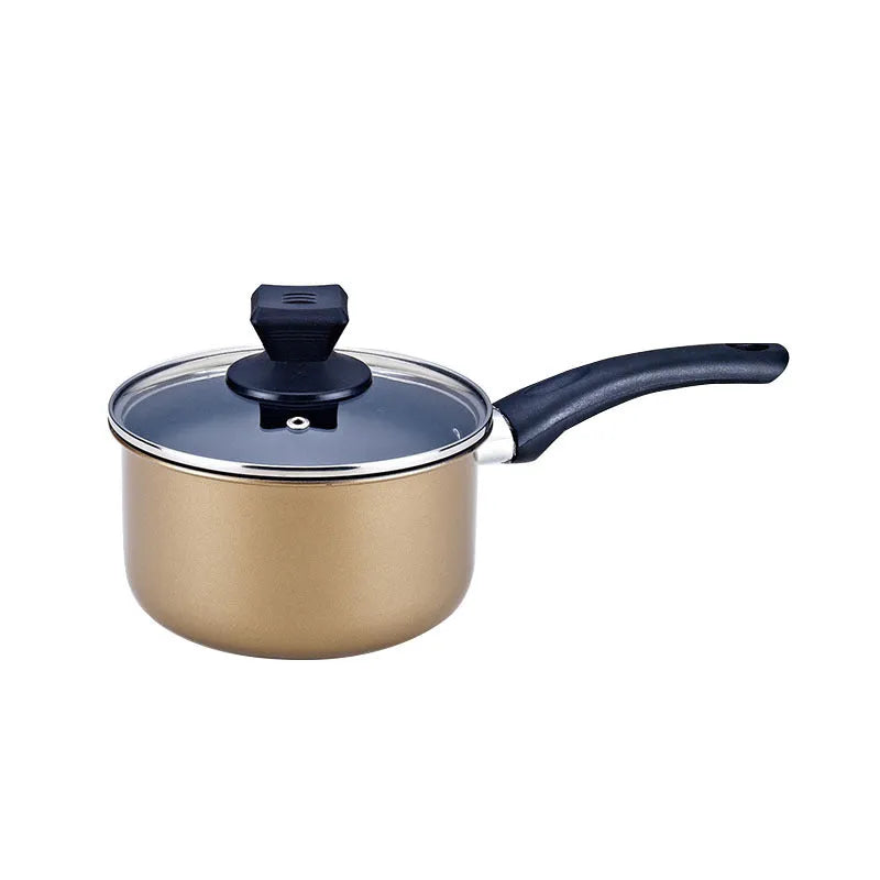 Cast iron three-piece cookware set with soup pot, milk pot, and wok on a kitchen counter