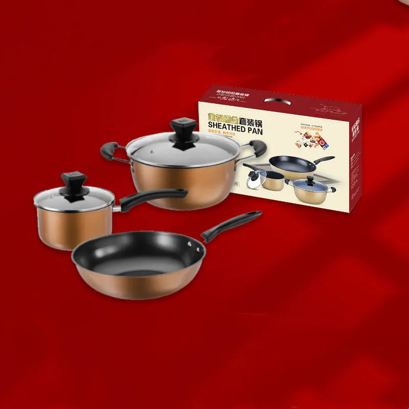 Cast iron three-piece cookware set with soup pot, milk pot, and wok on a kitchen counter