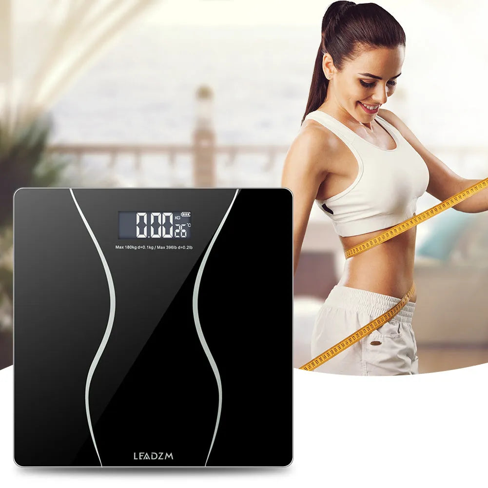Black electronic household scale with digital display for weight measurement up to 180kg