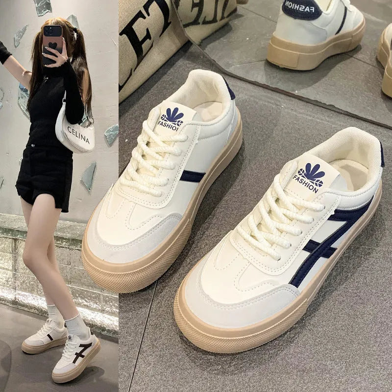 Brown and blue low-top casual board shoes with patent leather finish and round toe on a rubber sole.