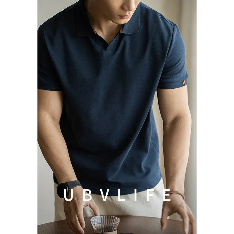 Men's blue short sleeve cotton polo shirt on a hanger, regular fit.