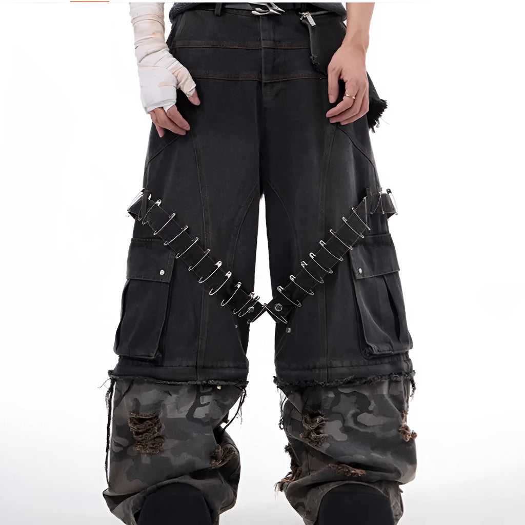 Men's grey jeans with camouflage pattern splicing and pin ribbon details on the legs.