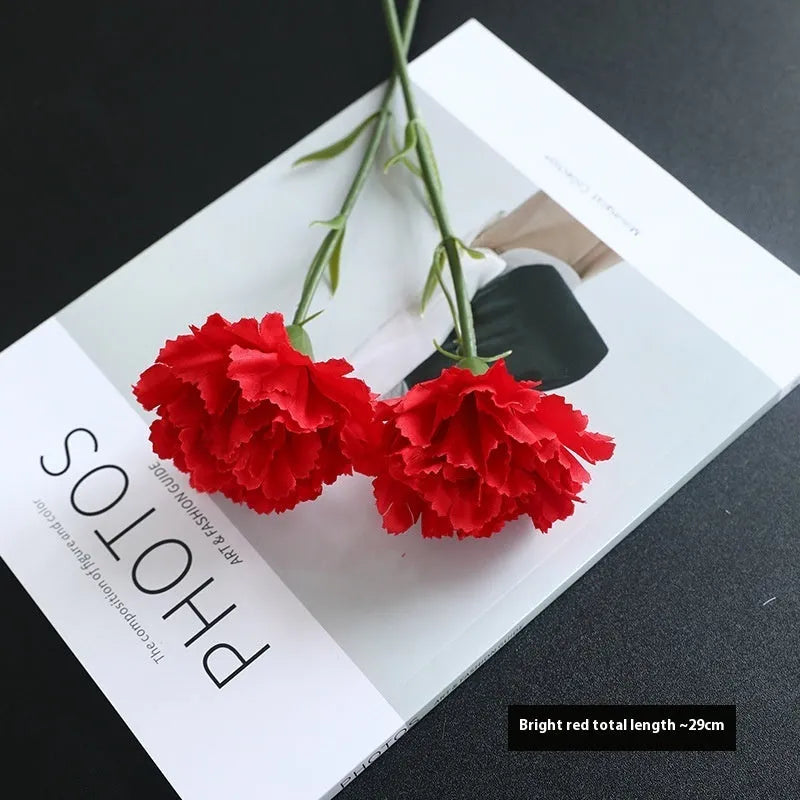 Artificial carnation flower with silk petals on soft rubber base in four colour options