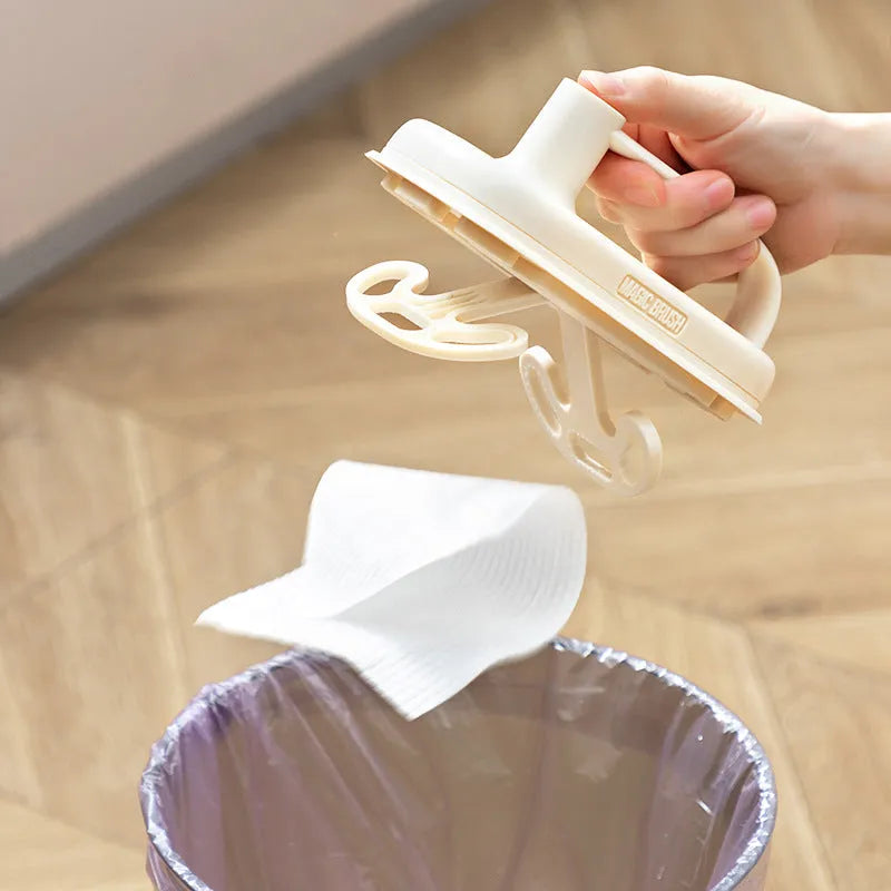 Magic Cleaning Brush with plastic handle and pack of 50 white disposable non-woven fabric rags.