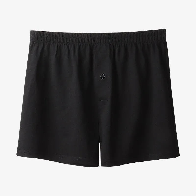 Men's high-waist cotton boxer shorts in light grey, navy blue, and black colours showing knitted fabric texture