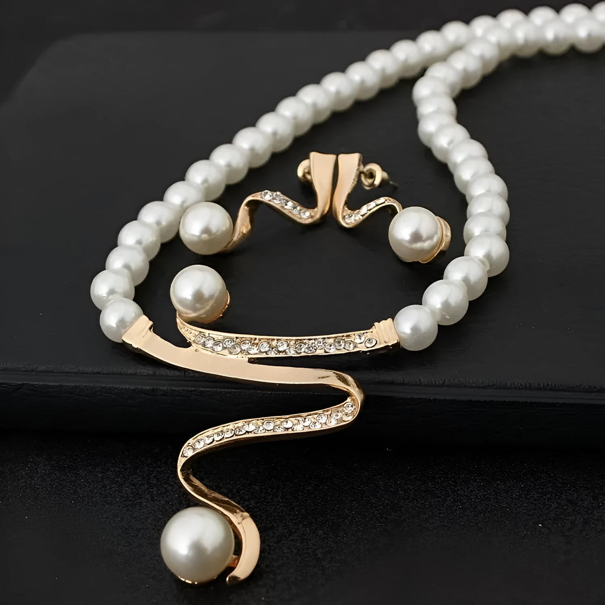 Gold electroplated pearl necklace and earrings jewellery suite with deep V clavicle design
