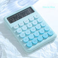Dopamine gradient colour desk calculator in violet, cherry blossom powder, glacier blue, mint green on a desk