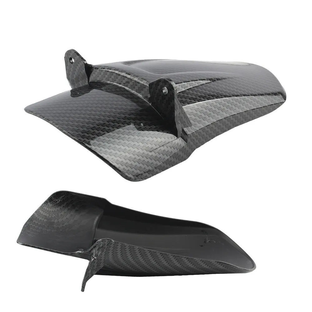Carbon fibre rear shock absorber fender for a Light Bee scrambler motorcycle.