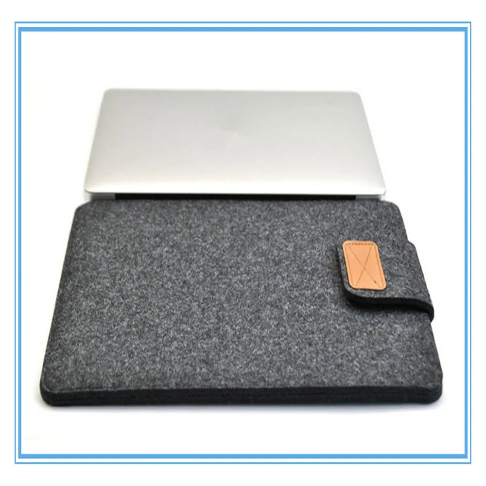 Dark grey clamshell laptop bag showing interior with polyester lining and corner protectors
