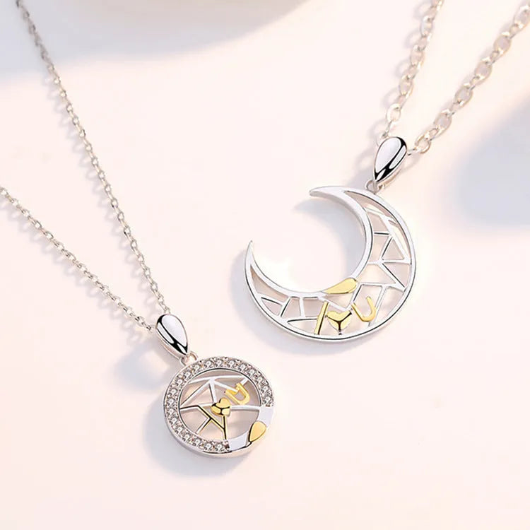 Sun Moon Tooth Couple Necklace with copper electroplated pendants showing sun and moon symbols on cross chain