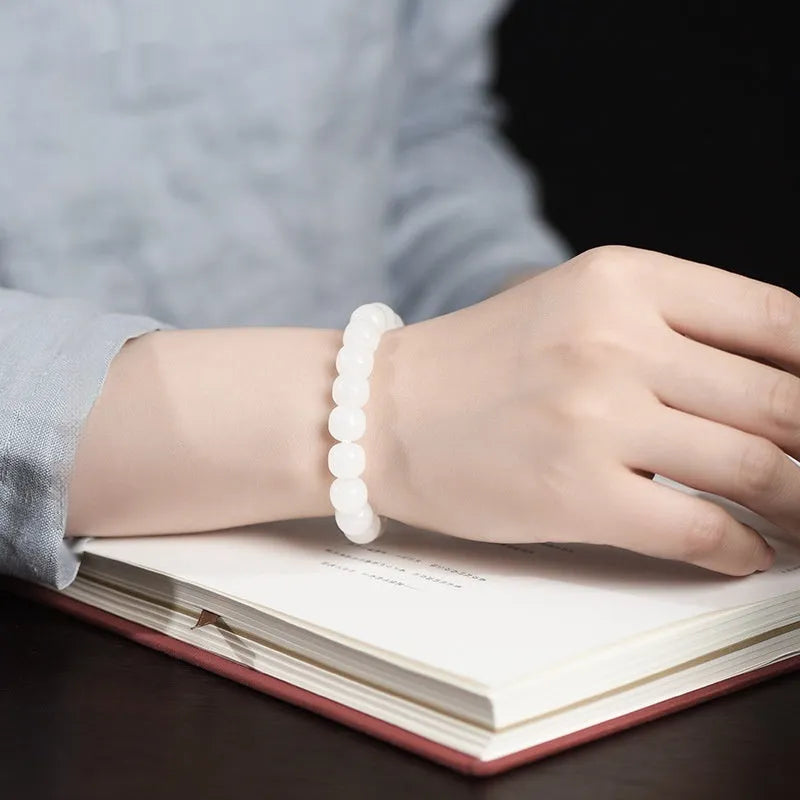 White jade barrel beads bracelet on wrist, showing Hetian jade beads in casual unisex design