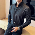 Men's slim fit long-sleeved denim shirt in solid colour on a hanger