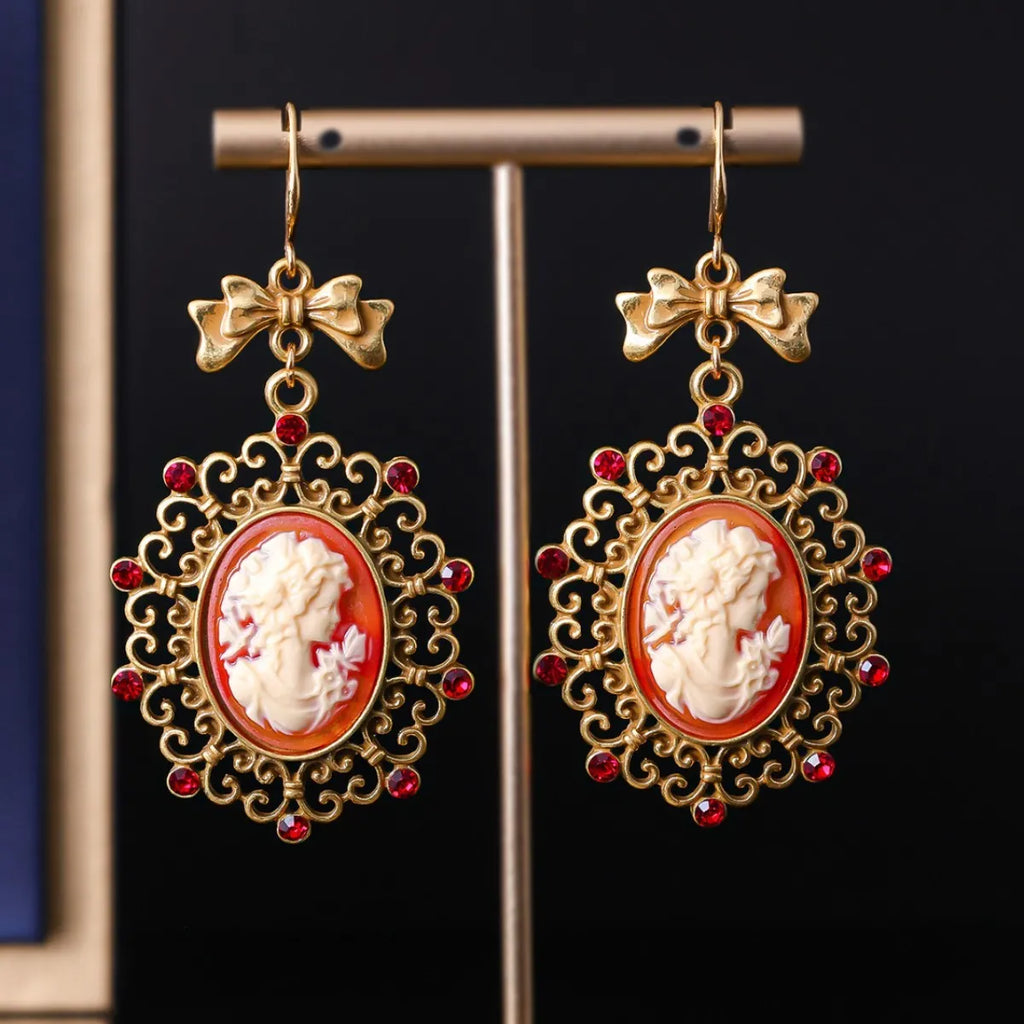 Retro court beauty head alloy drop earrings with bow detail and electroplated finish, one pair