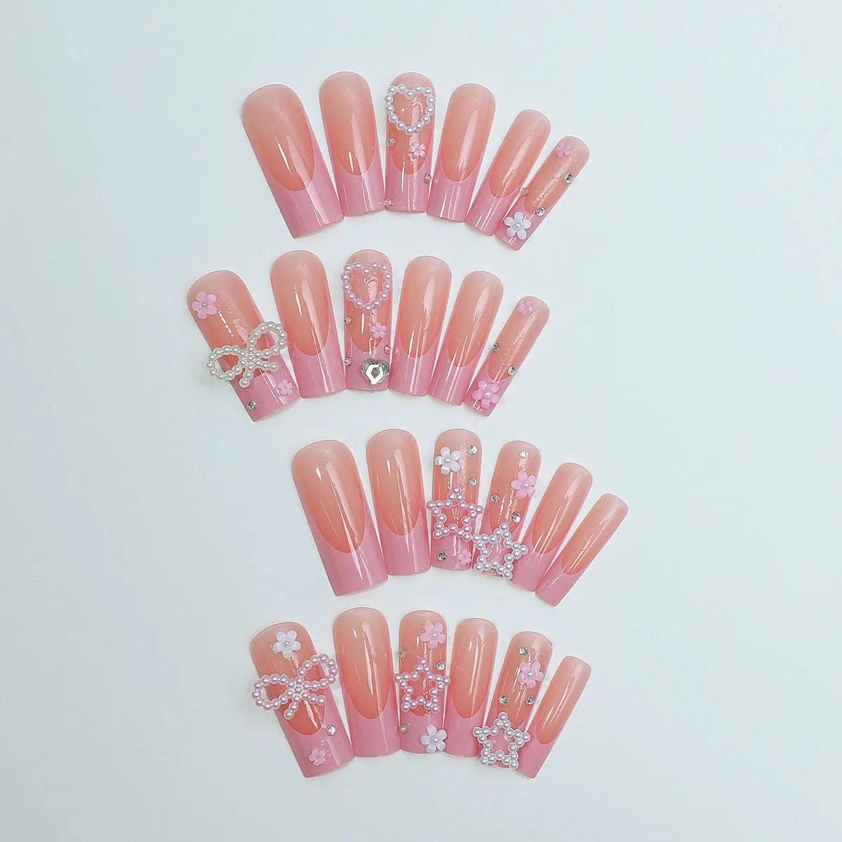 Super long French manicure nails with spot drill detailing and bow accent in XB-70-48 colour