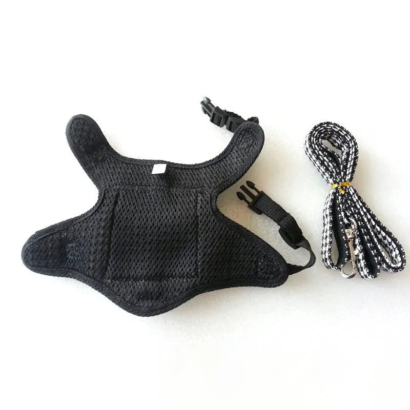 Black houndstooth cotton vest for a small dog, showing the leash attachment strap on the back.
