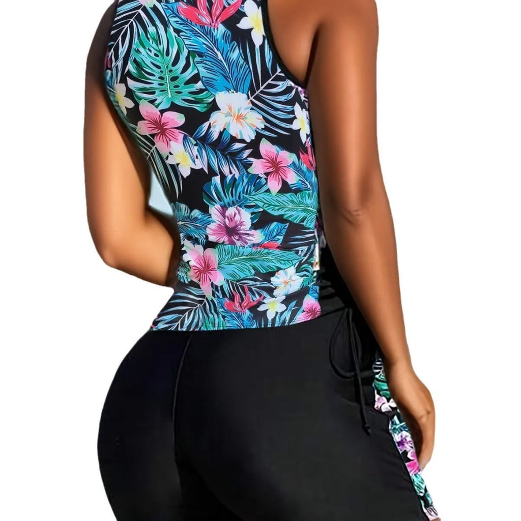 Plus-size woman modelling a high-waisted floral print bikini in blue, for swimming.