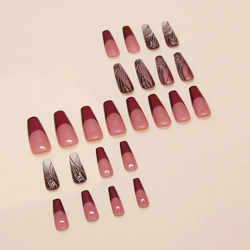 Pack of 24 French line pattern false nail stickers and glue tube on a white background.