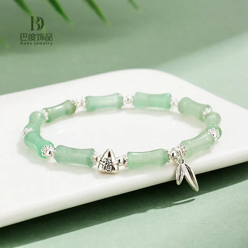 Green Aventurine bamboo crystal bracelet with multiple gemstones including strawberry quartz and olive jade