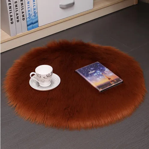 Round beige wool plush carpet floor mat on a wooden floor.
